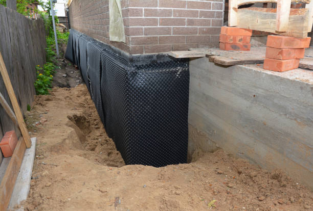 Happy homeowners after waterproofing job in Whitelaw